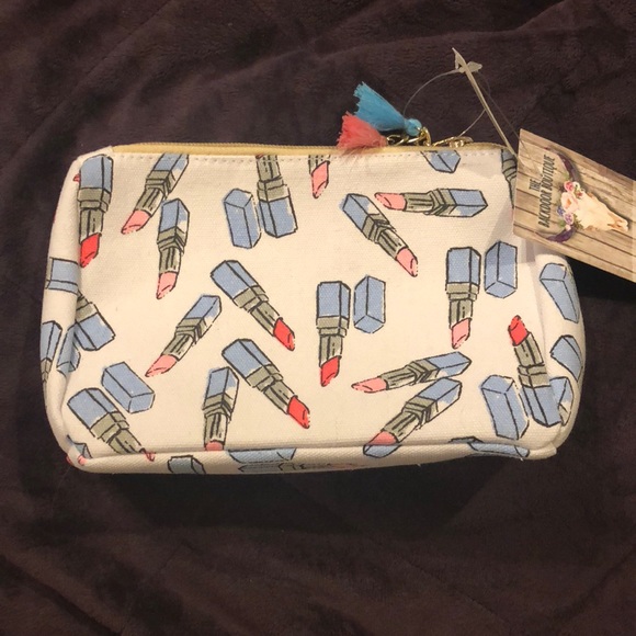 Handbags - Makeup bag with lipstick pattern.